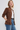 side view of long sleeve jacket with cinch waist and puff sleeve