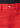 front, zip and button of red jeans