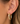 up close picture of brushed gold hoops on womens ear