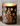 dark tree lantern against brck background
