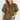 A woman wearing a short-sleeve olive green blouse with a dense multicolor floral print, paired with light blue jeans, against a plain light gray background.