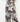 A close-up of a person wearing wide-leg trousers with a bold floral print in gray, burgundy, navy, and cream, featuring a drawstring waistband.