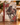 An 8x7 inch journal with a vintage-style Christmas horse cover design, standing on a wooden table with holiday decorations and a lit candle in the background.