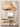picture of charcuterie board with crackers, cheese and fruits with serving knife on table
