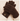 A pair of dark brown fuzzy knit gloves with a small gold embroidered monogram on the cuff, resting on a cream-colored ribbed knit sweater.