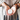 A person holds a small round tin of Whimsing Willow Hand & Foot Salve in their hands, wearing stacked wooden bangles and a taupe top against a softly blurred background.