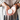 A person holds a small round tin of Whimsing Willow Hand & Foot Salve in their hands, wearing stacked wooden bangles and a taupe top against a softly blurred background.