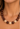 brown and cream beaded swirl necklace on ladies neck

