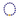 A beaded bracelet featuring deep blue spherical beads separated by small gold metallic spacer beads, with a larger polished gold ball accent at the bottom center, shown on a plain white background.