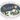An oval Christmas-themed plate or serving platter with a white rim, featuring a painted winter village scene. Santa Claus in a sleigh with reindeer flies across a dark blue night sky above a snowy house, evergreen trees, holly, and a full moon.
