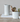 stoneware pitcher on book on table with ktichen tools
