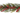 A festive artificial garland featuring green cypress or cedar-like foliage interspersed with clusters of small red berries, shown against a plain white background.