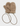 A pair of beige sherpa fleece mittens with a matching brown cord accessory and small gold-tone hardware, photographed on a clean light gray background.