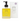 A bottle of Whispering Willow Natural Body Oil Lavender next to its white packaging box, both featuring a black pump and a yellow label, on a white background.